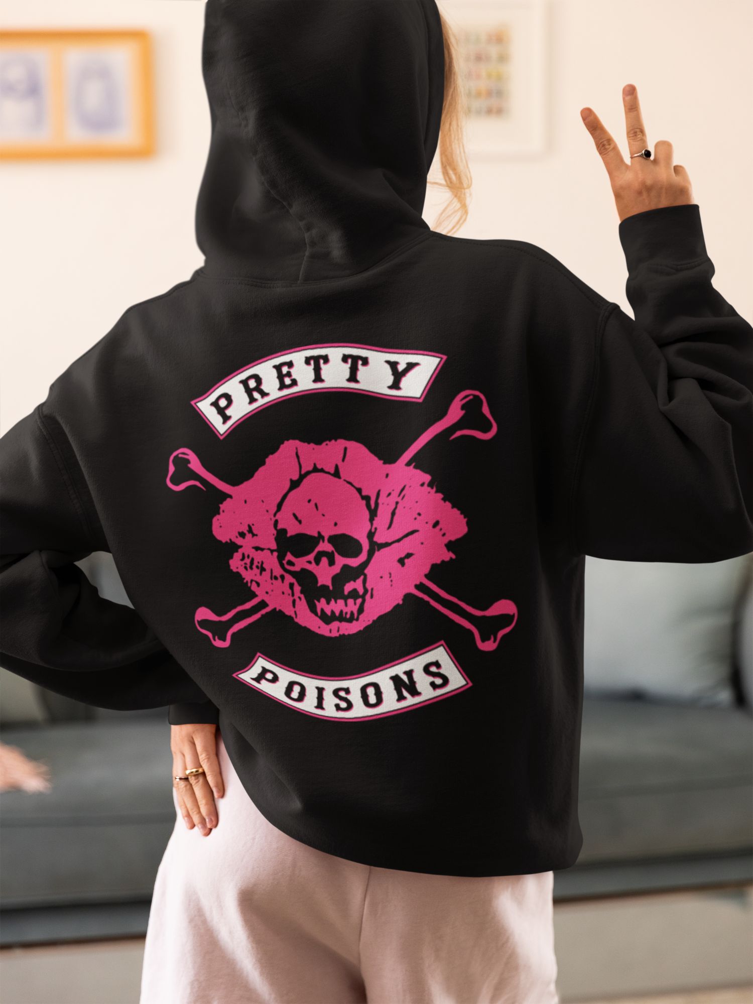 Pretty Poisons Riverdale Hoodie With Pink Skull & Crossbones Graphic — front view